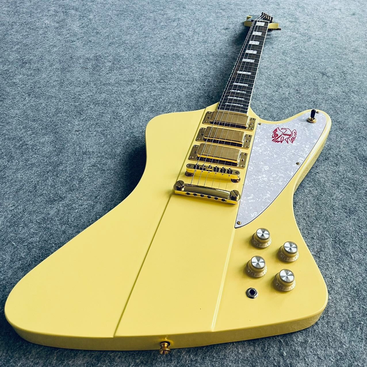 Yellow Firebird Style Guitar