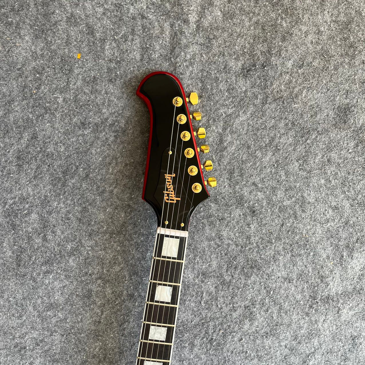 Red Gibson Firebird Style Guitar