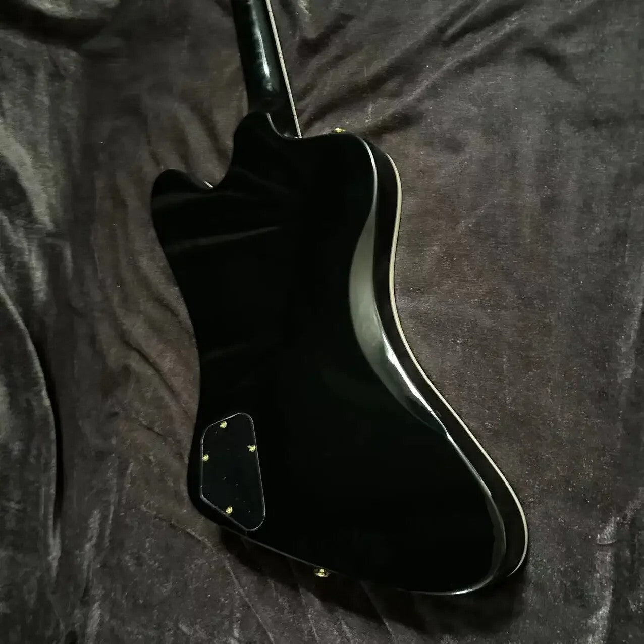 Black Gibson Firebird Style Guitar
