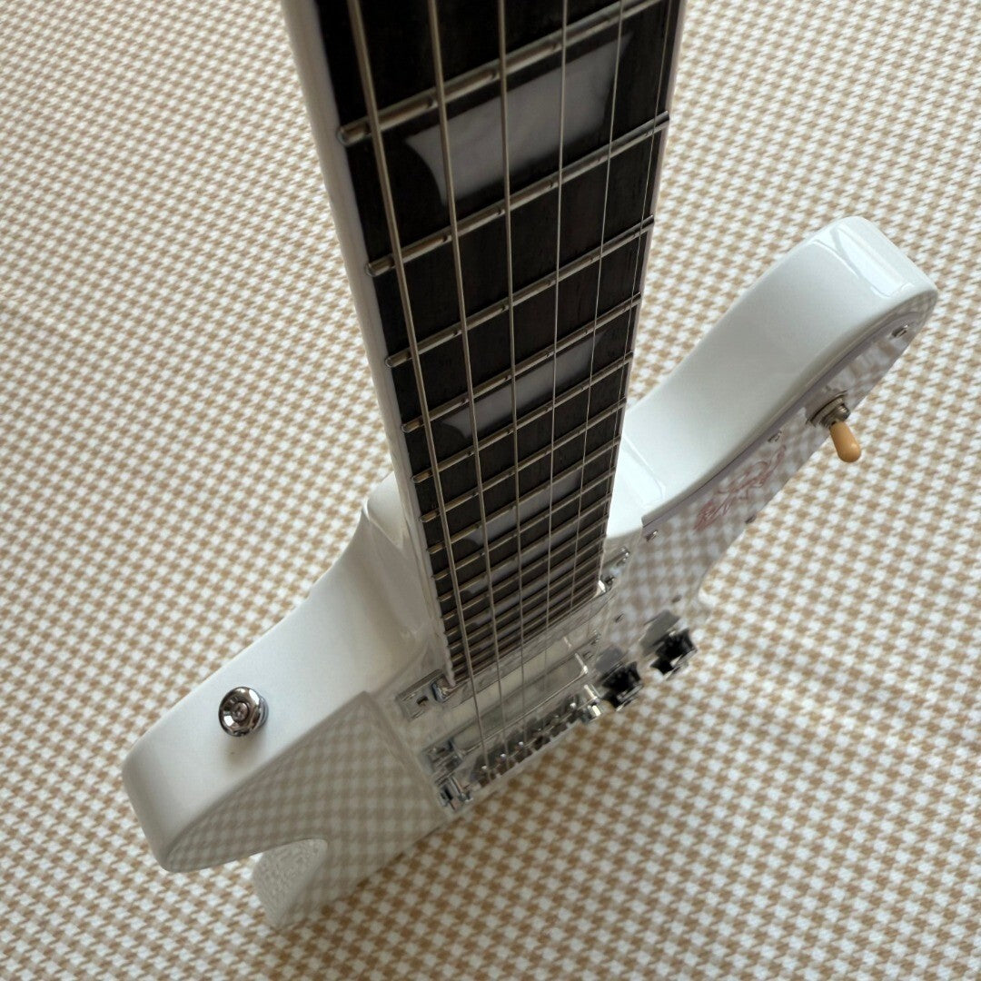 White Gibson Firebird Style Guitar