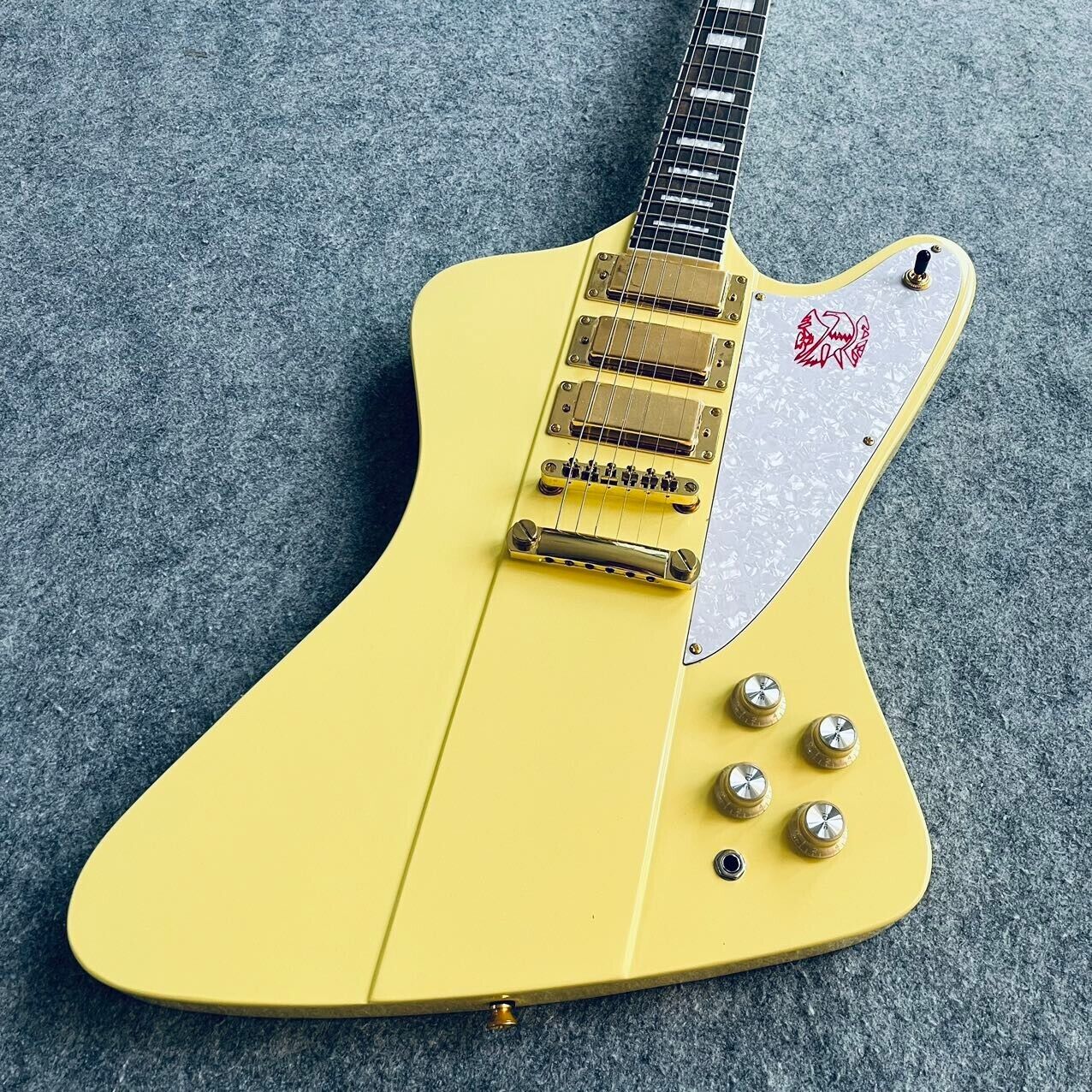 Yellow Firebird Style Guitar
