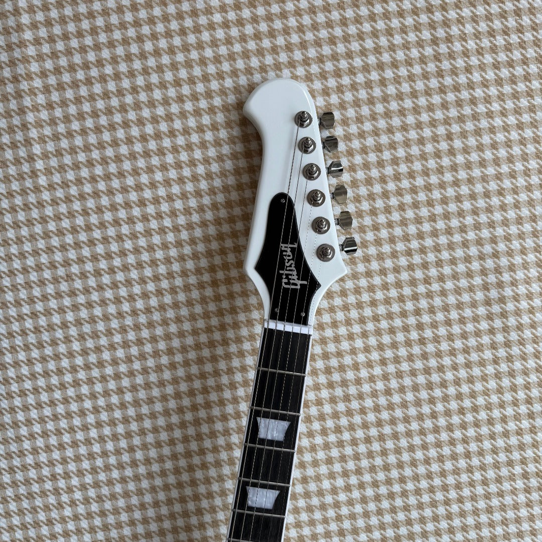White Gibson Firebird Style Guitar