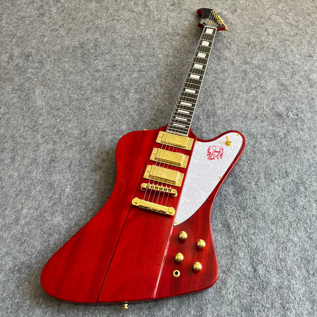Red Gibson Firebird Style Guitar