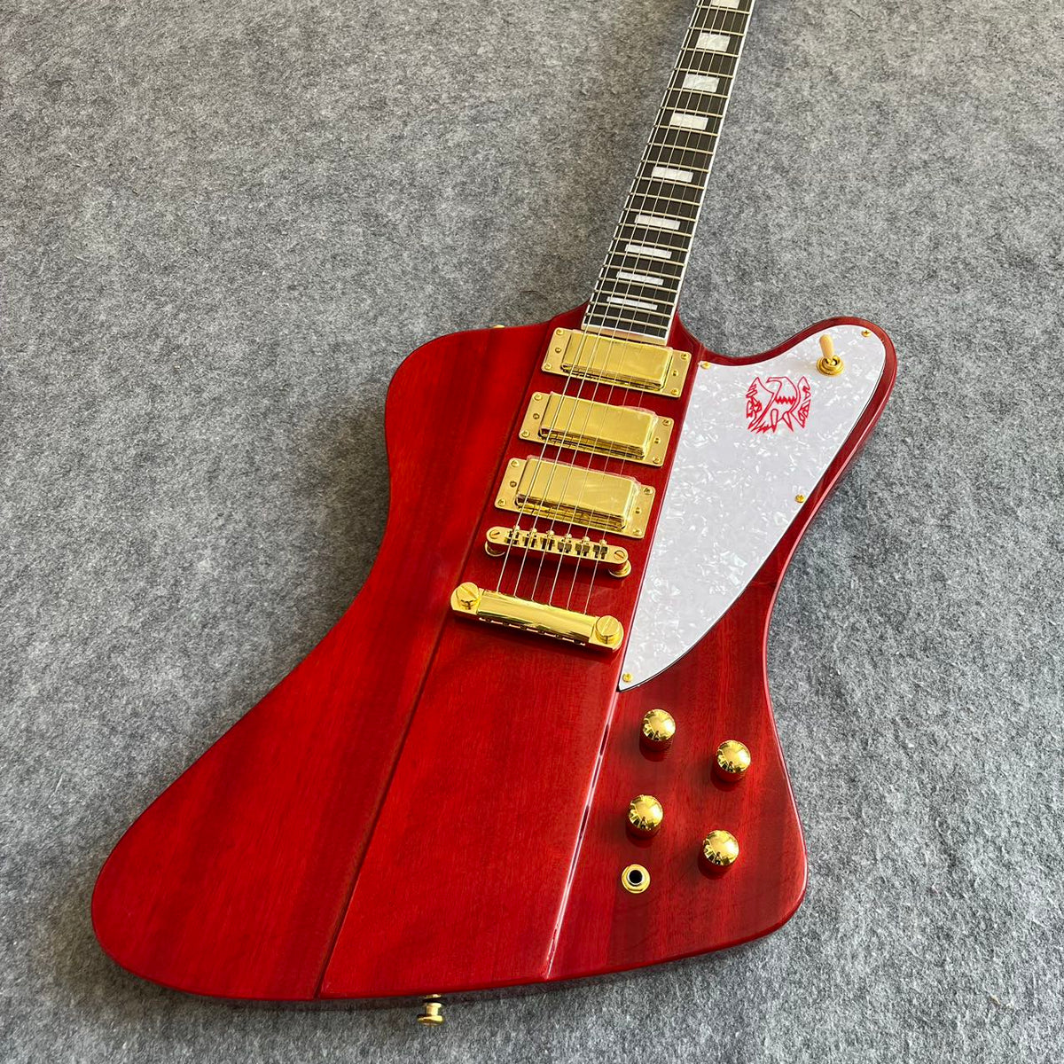 Red Gibson Firebird Style Guitar