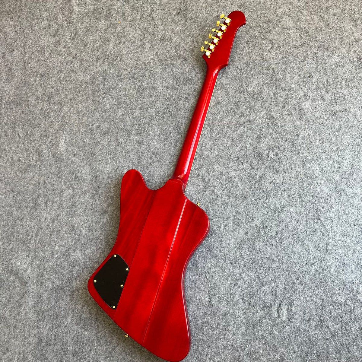 Red Gibson Firebird Style Guitar