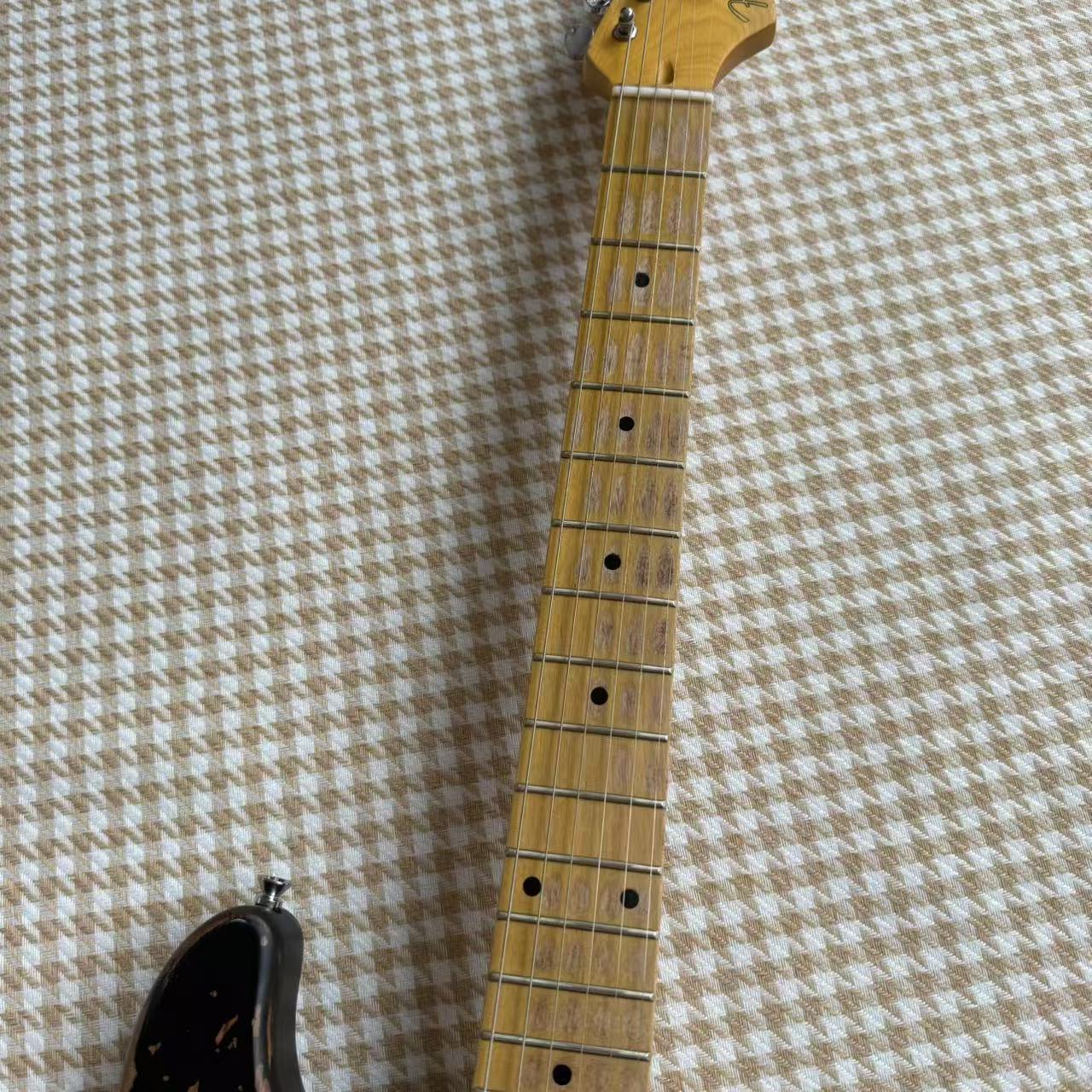 Worn Black Stratocaster Guitar