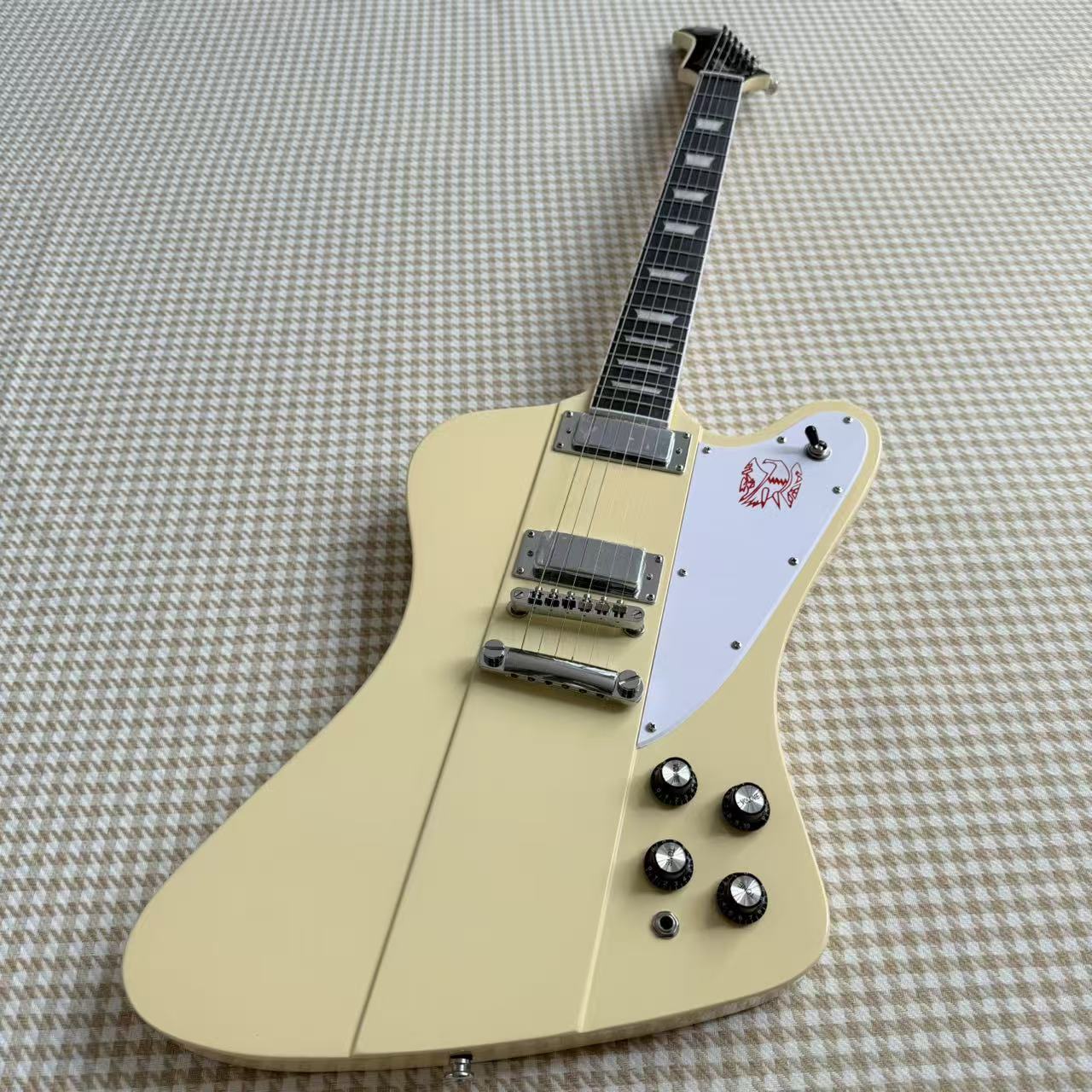 Cream Gibson Firebird Style Guitar With White Scratch Plate