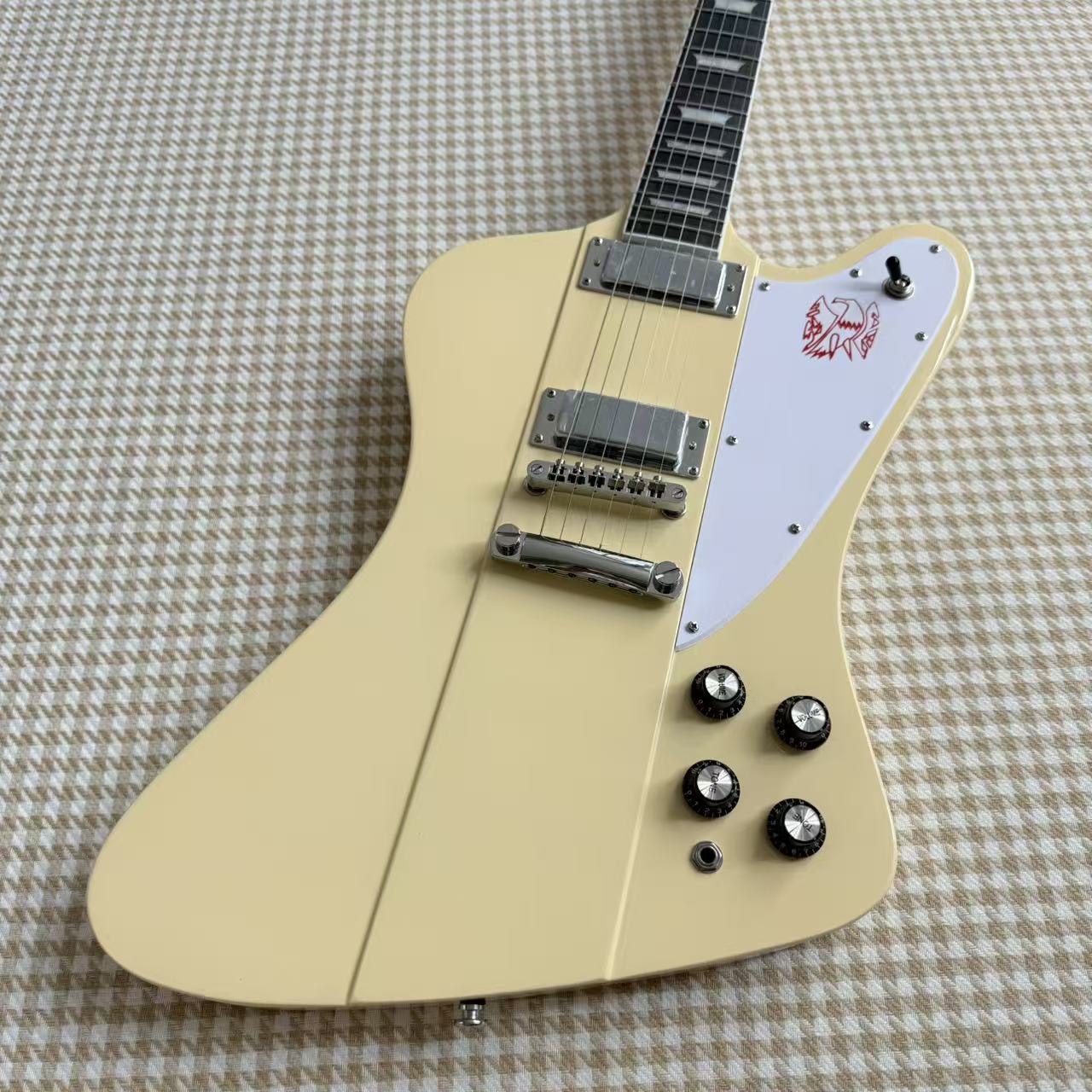 Cream Gibson Firebird Style Guitar With White Scratch Plate