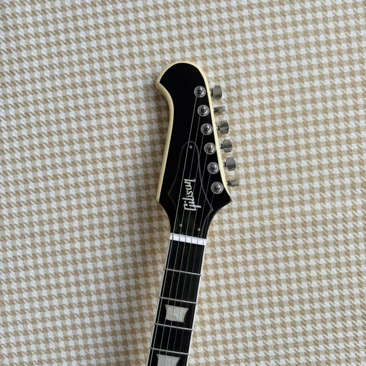 Cream Gibson Firebird Style Guitar With White Scratch Plate