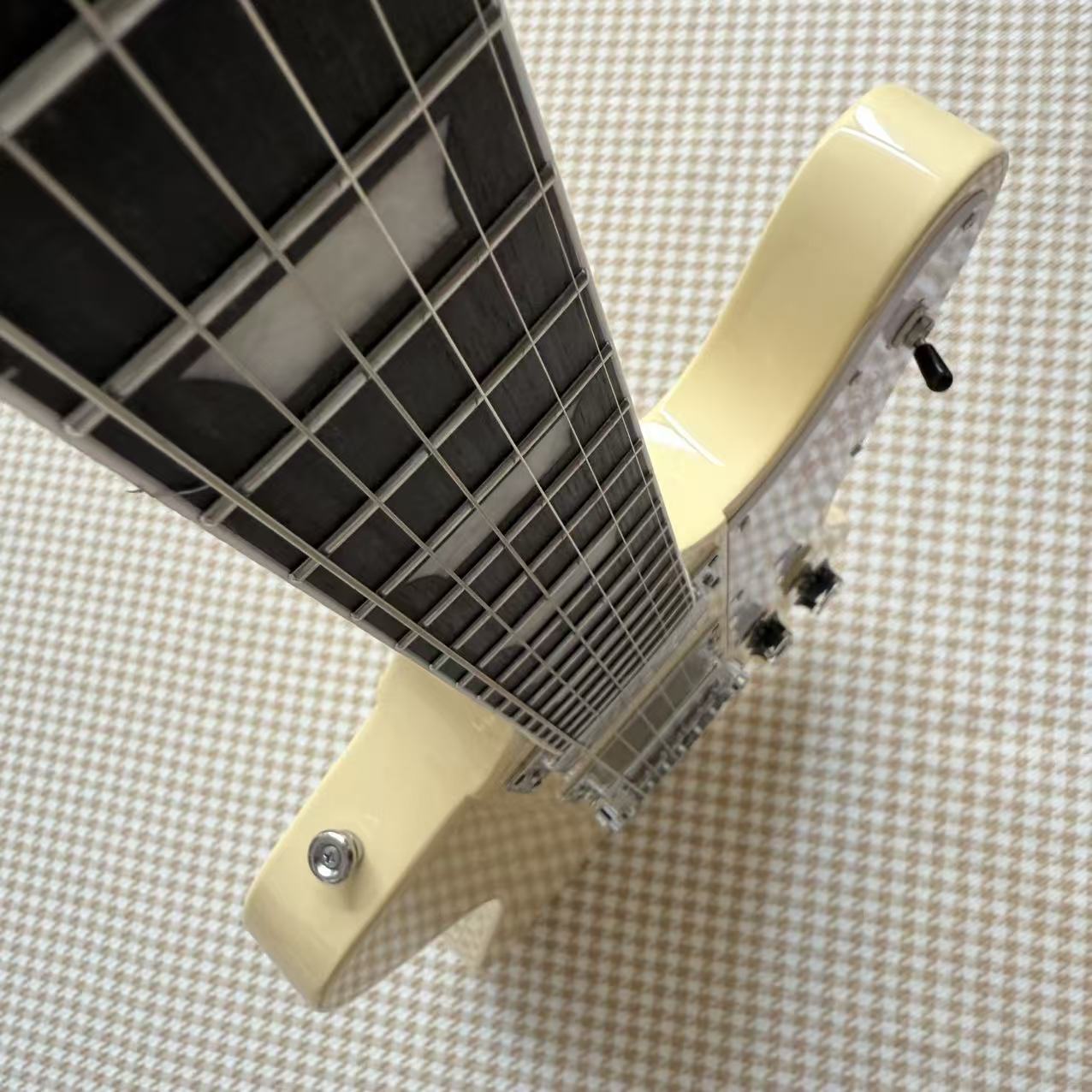 Cream Gibson Firebird Style Guitar With White Scratch Plate