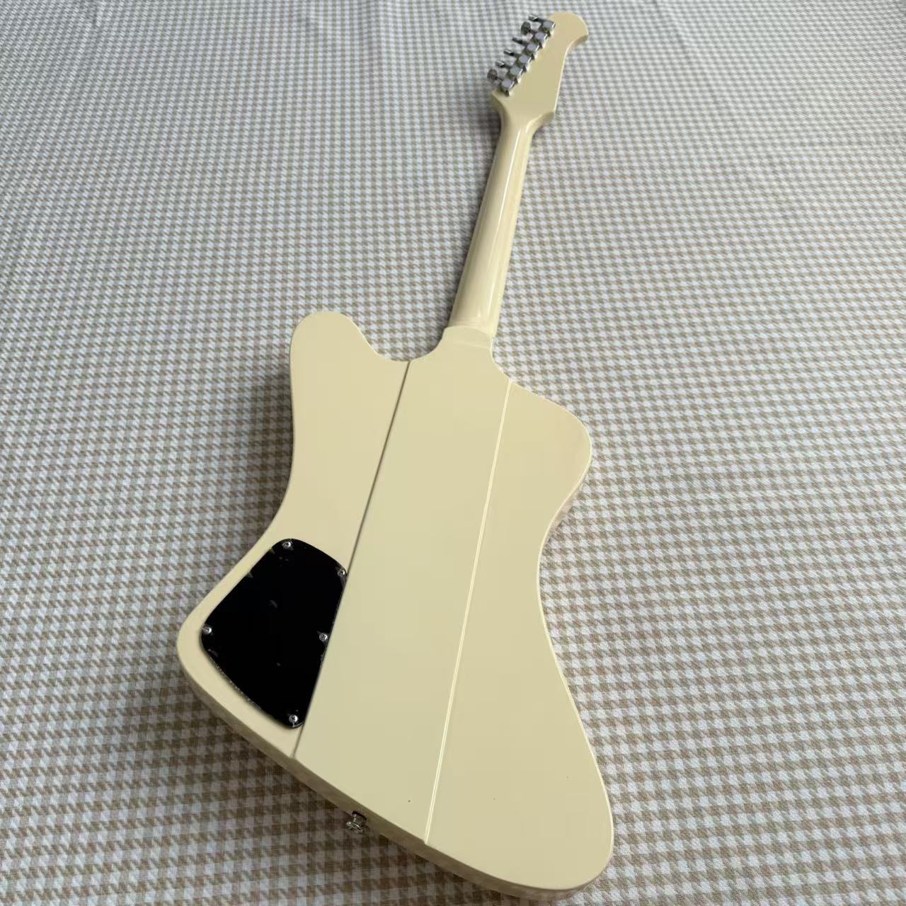 Cream Gibson Firebird Style Guitar With White Scratch Plate