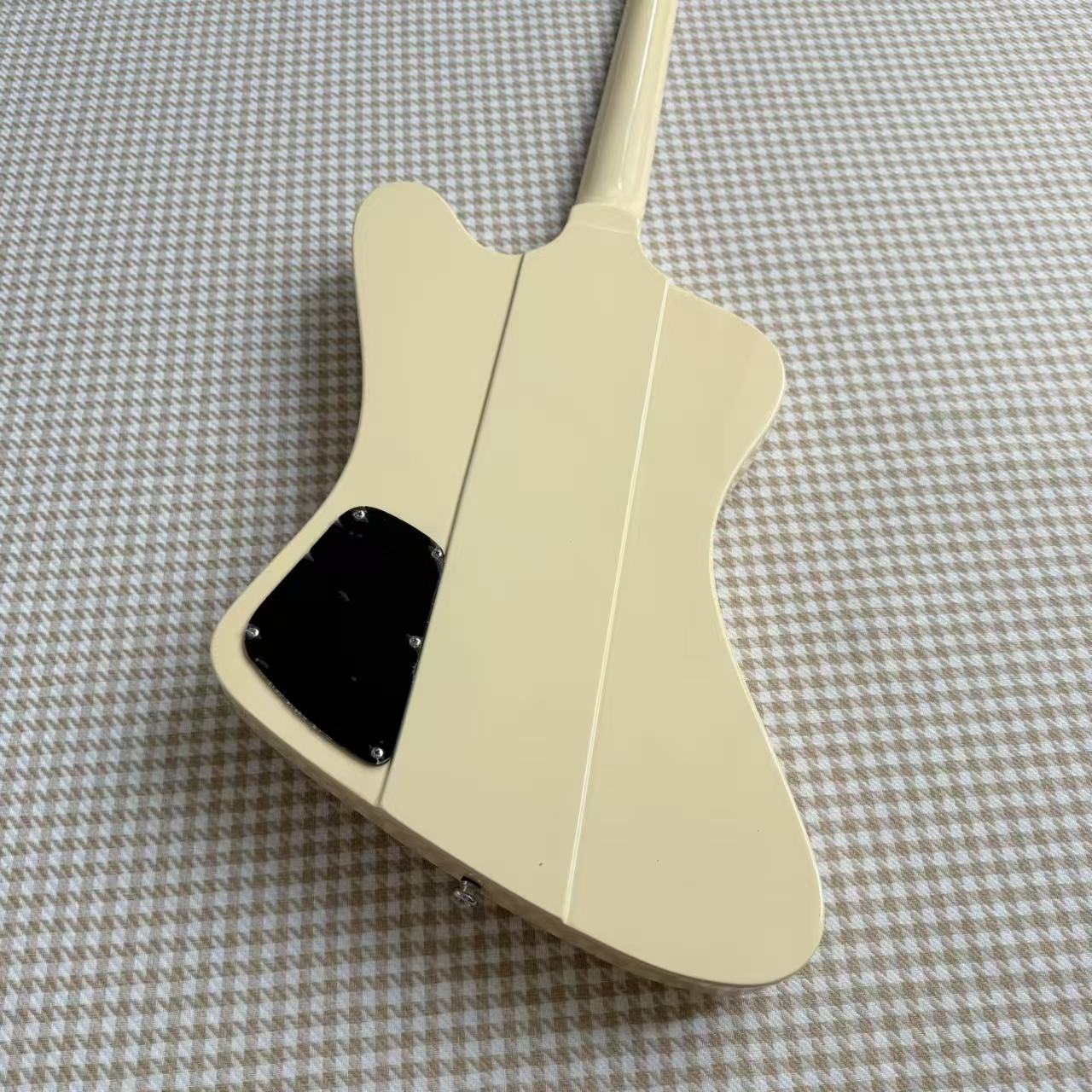 Cream Gibson Firebird Style Guitar With White Scratch Plate